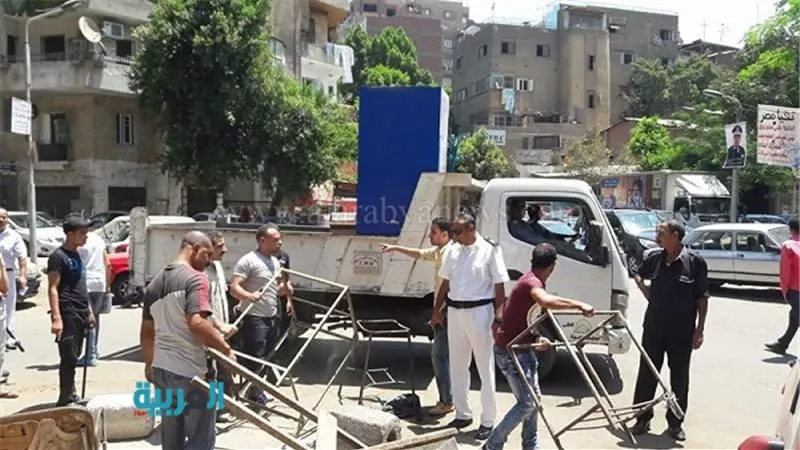 بالصور.. إزالة إشغالات الباعة الجائلين بشوارع الدقي 